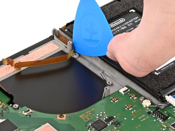 Nintendo Switch 2 Button Board Replacement, Free the button board cable: crwdns2935265:037crwdnd2935265:02crwdnd2935265:02crwdne2935265:0