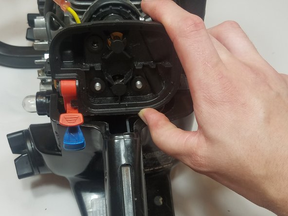 Slide the air filter housing back onto the carburetor mounting bolts