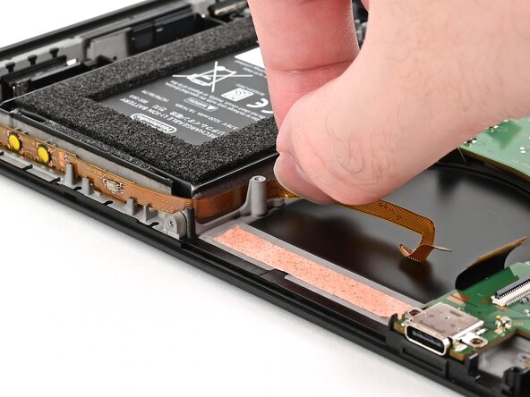 Nintendo Switch 2 Button Board Replacement, Route the button board cable: crwdns2935265:041crwdnd2935265:02crwdnd2935265:03crwdne2935265:0