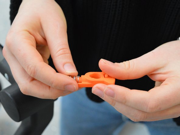 Bugaboo Cameleon 1 and 3 Swivel Wheel Lock Replacement, Attaching the new part: step 7, image 2 of 2