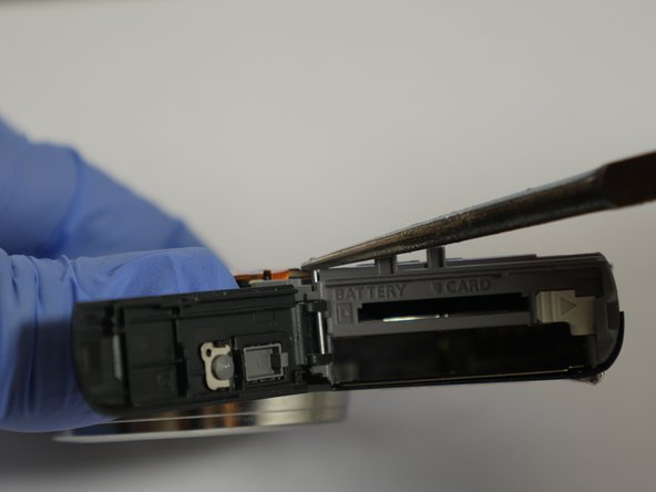 Panasonic Lumix DMC-FH27 Door Replacement, Pulling out the rod: crwdns2935265:013crwdnd2935265:03crwdnd2935265:03crwdne2935265:0