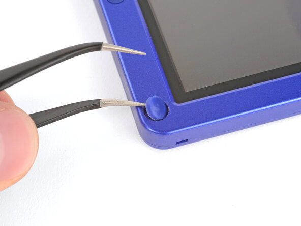 How to Reshell Your Game Boy Advance SP, Remove the rubber screw covers: crwdns2935265:019crwdnd2935265:02crwdnd2935265:03crwdne2935265:0