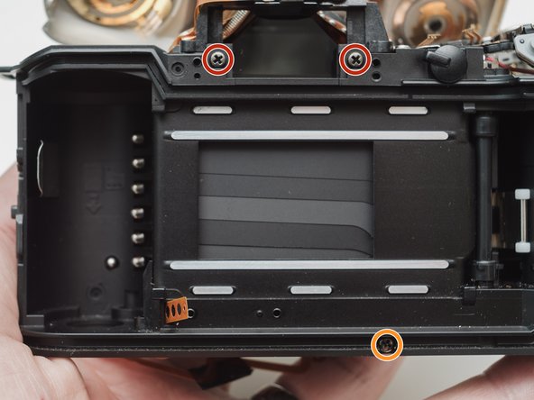 Pentax ZX-5n Mirror Motor Gear Replacement, Unscrew front housing block: crwdns2935265:025crwdnd2935265:01crwdnd2935265:02crwdne2935265:0