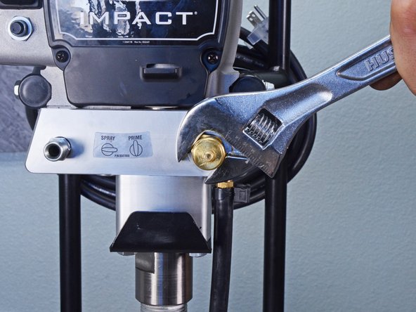 Titan Airless Sprayer IMPACT 410 Bypass Valve Assembly Replacement, Loosen the bypass valve assembly: crwdns2935265:05crwdnd2935265:02crwdnd2935265:02crwdne2935265:0