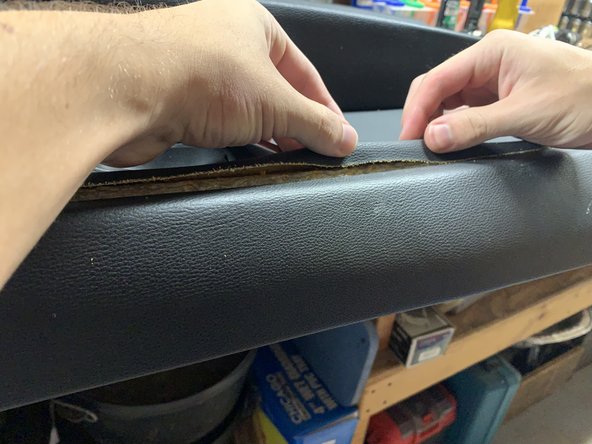 Push the liner into place in between the door panel sections.