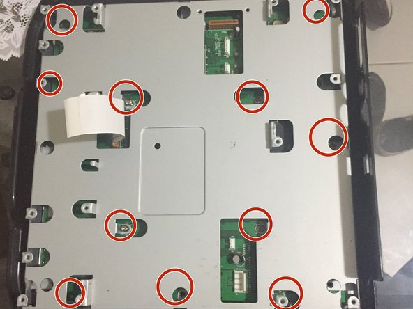 SNK Neo Geo CD Teardown, step 11: crwdns2935265:011crwdnd2935265:03crwdnd2935265:03crwdne2935265:0
