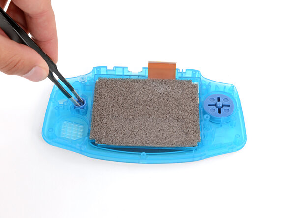 How to Reshell Your Game Boy Advance, Install the D‑pad and action buttons: crwdns2935265:024crwdnd2935265:02crwdnd2935265:03crwdne2935265:0