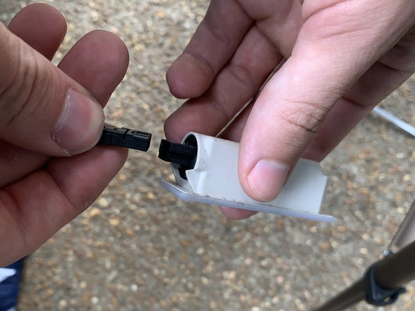 Pop the light out of the bottom of the door panel and then unplug it.