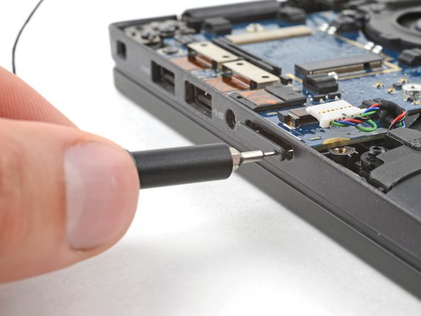 Dell Latitude 7410 I/O Board Replacement, Remove the SIM card tray: crwdns2935265:015crwdnd2935265:02crwdnd2935265:03crwdne2935265:0