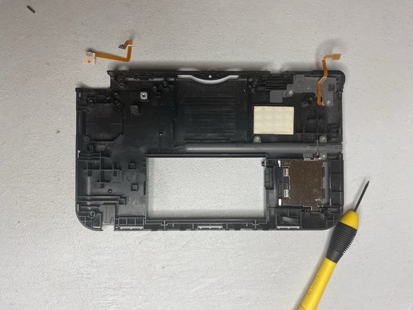 Nintendo 3DS XL Left Bumper Replacement: step 9, image 2 of 2