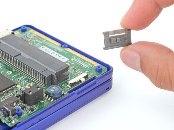 Nintendo Game Boy Advance SP Buttons Replacement, Remove the power switch cover: crwdns2935265:09crwdnd2935265:02crwdnd2935265:02crwdne2935265:0