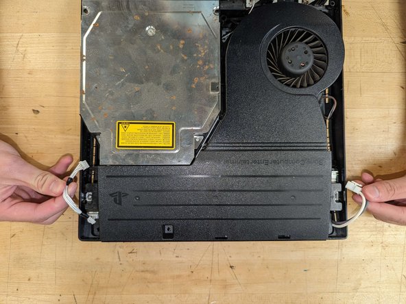 PlayStation 3 Slim Thermal Paste Replacement, Power supply removal: crwdns2935265:07crwdnd2935265:03crwdnd2935265:03crwdne2935265:0