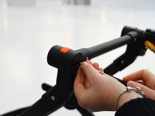 Bugaboo Cameleon 1 and 3 Swivel Wheel Lock Replacement, Securing the part: step 10, image 2 of 2