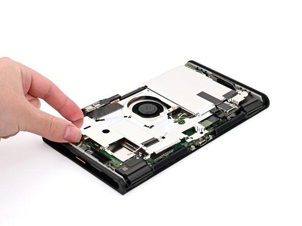 Nintendo Switch 2 Microphone Replacement, Lower the shield plate: crwdns2935265:043crwdnd2935265:02crwdnd2935265:02crwdne2935265:0