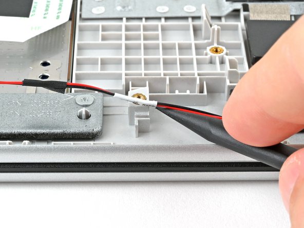 HP 15-fc0000 Series Speakers Replacement, Lift the speaker wire: crwdns2935265:016crwdnd2935265:02crwdnd2935265:02crwdne2935265:0