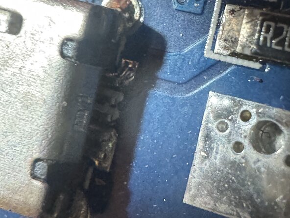 Power Bank - Resolder USB Ports, Inspect Back Sides of Power Bank USB-B (micro) Port: step 4, image 2 of 2