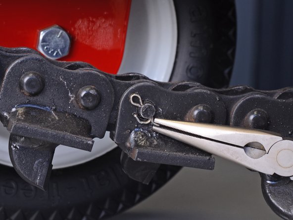 Barreto Trencher E718MTH4S 2016 Chain Roller Spacer Replacement, Remove the cotter pin: step 3, image 2 of 3