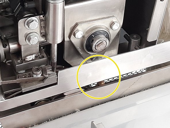 MF 2700A usage training, THREADING THE STRAP INTO THE MACHINE: step 12, image 1 of 2