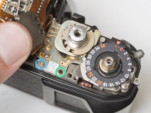 Pentax Super Program Front Lens Board Removal, Detach mode dial unit: crwdns2935265:012crwdnd2935265:03crwdnd2935265:03crwdne2935265:0