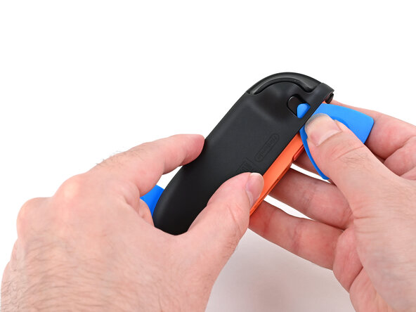 Joy-Con 2 (Right) Joystick Replacement, Release the back cover: crwdns2935265:09crwdnd2935265:01crwdnd2935265:03crwdne2935265:0