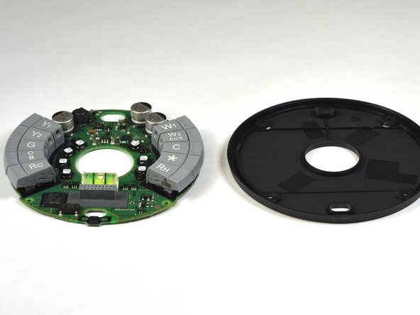 Nest Learning Thermostat 2nd Generation Base Motherboard Replacement, Remove base motherboard from base back: crwdns2935265:07crwdnd2935265:03crwdnd2935265:03crwdne2935265:0