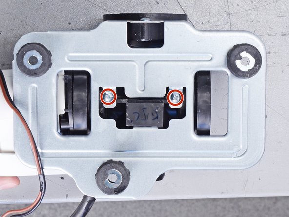 LG Front Load Washing Machine Drain Pump Motor Replacement, Unfasten the pump bracket: crwdns2935265:037crwdnd2935265:02crwdnd2935265:02crwdne2935265:0