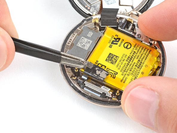 Google Pixel Watch 2 Vibration Motor Replacement, Peel up the vibration motor cable tape: step 12, image 2 of 3