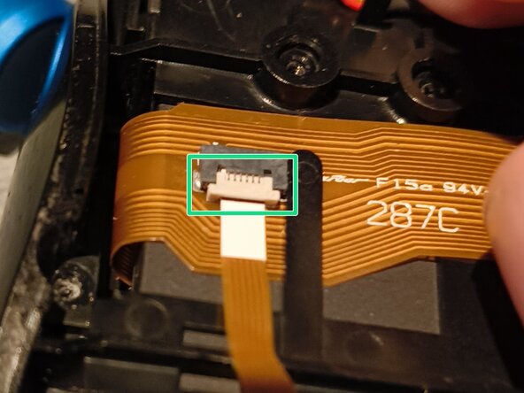 Logitech MX Air Battery Replacement, Unscrew, then disconnect another ribbon cable, and lift one up: crwdns2935265:05crwdnd2935265:02crwdnd2935265:03crwdne2935265:0