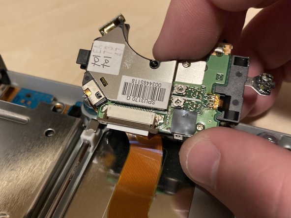 PlayStation 2 Slimline SPU-3170 Laser Replacement, Disconnect the laser: crwdns2935265:07crwdnd2935265:02crwdnd2935265:03crwdne2935265:0