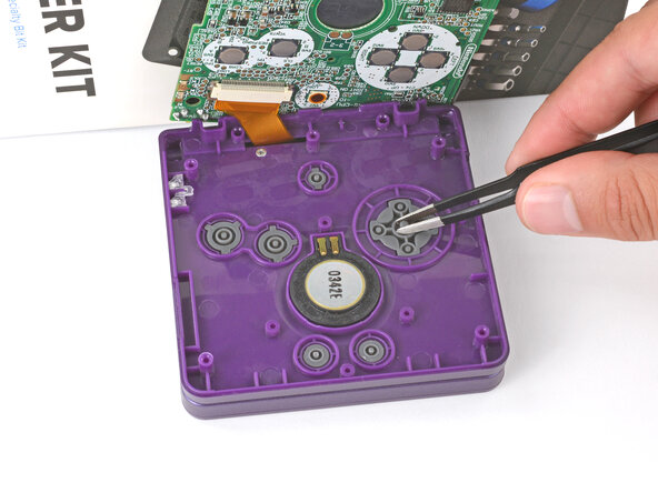 How to Reshell Your Game Boy Advance SP, Install the buttons and silicone pads: crwdns2935265:057crwdnd2935265:02crwdnd2935265:03crwdne2935265:0