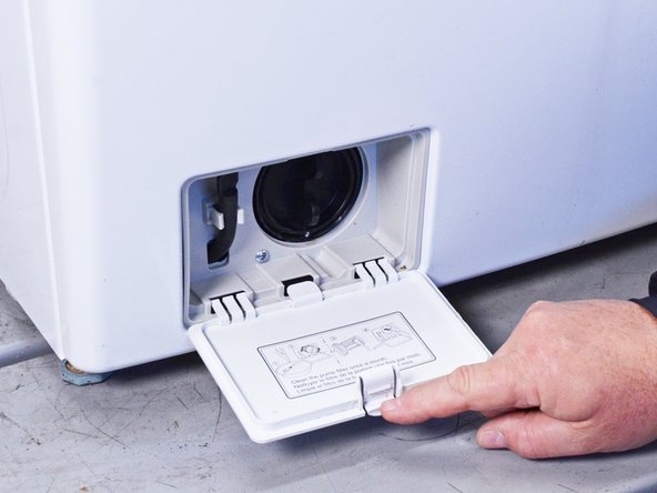 LG Front Load Washing Machine Temperature Sensor Replacement, Remove the filter panel: crwdns2935265:017crwdnd2935265:02crwdnd2935265:03crwdne2935265:0