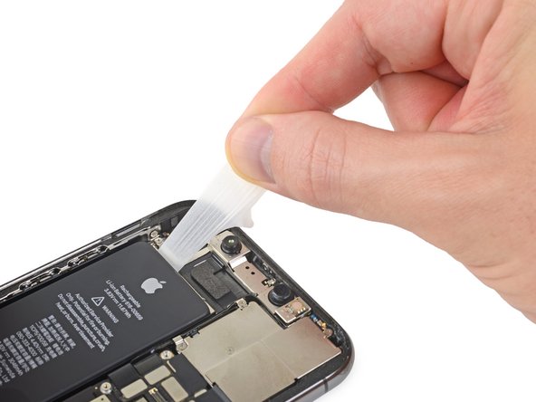 iPhone 11 Pro Battery Replacement, Remove the top adhesive strip: crwdns2935265:039crwdnd2935265:02crwdnd2935265:03crwdne2935265:0