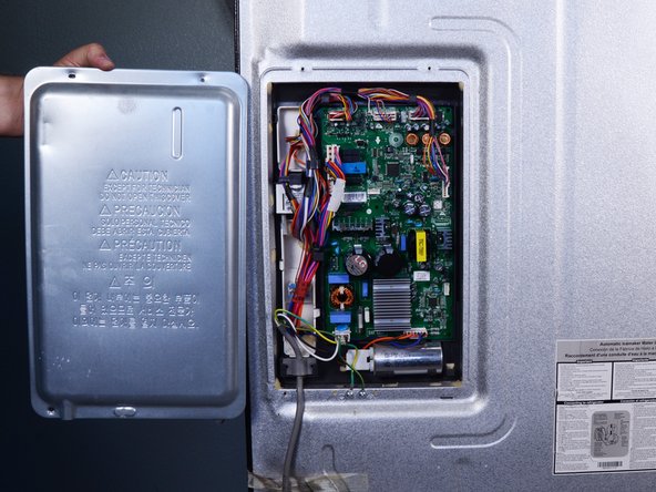 LG Refrigerator Control Board Replacement, Remove the control board cover: crwdns2935265:03crwdnd2935265:03crwdnd2935265:03crwdne2935265:0