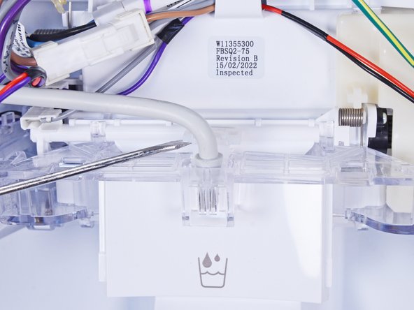 WRS315SDHW Dispenser Assembly Replacement, Remove the plastic clip: crwdns2935265:09crwdnd2935265:02crwdnd2935265:03crwdne2935265:0