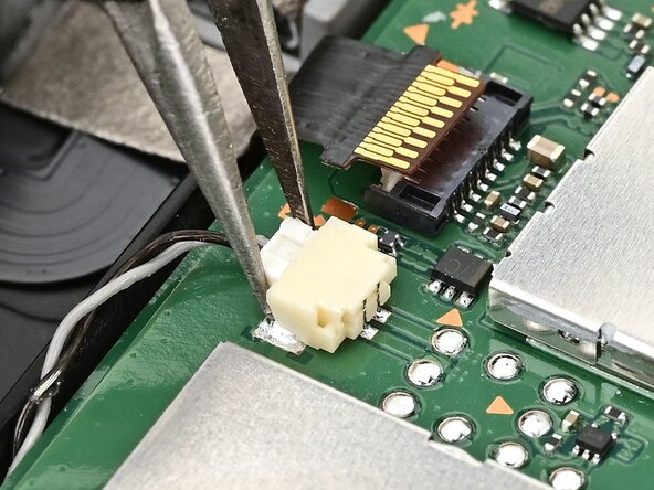 Nintendo Switch 2 Board Replacement, Disconnect the right speaker: crwdns2935265:052crwdnd2935265:01crwdnd2935265:02crwdne2935265:0