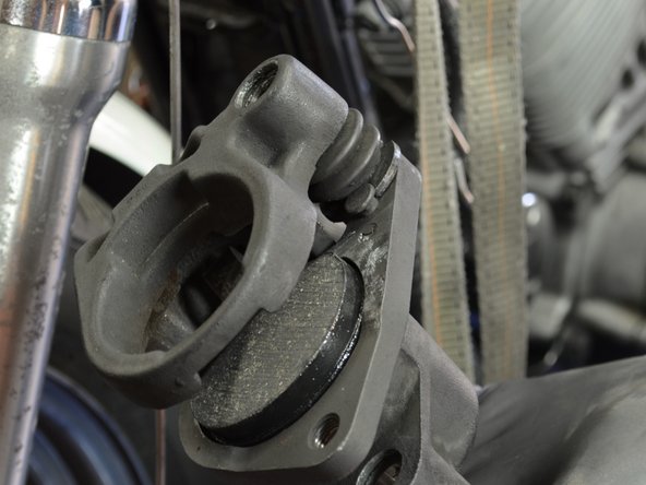 The anti-squeal side of the brake pad should be facing away from the stationary caliper, and towards the brake piston.