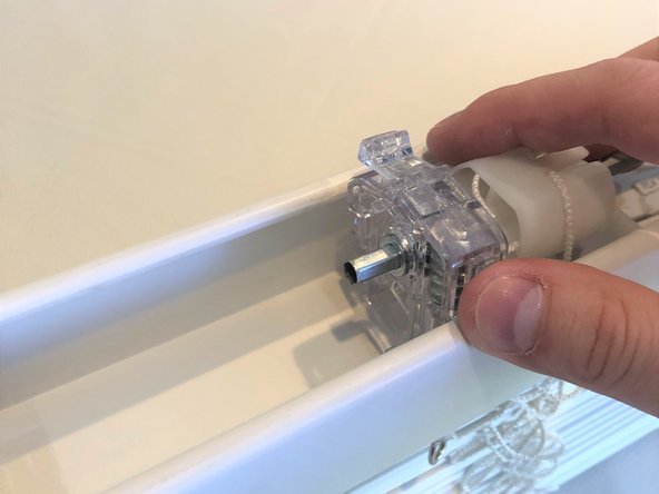 Once slid into position, reinsert the center rod by pushing down on the assembly.