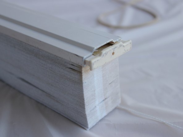 Push the bottom end caps back onto the rail.