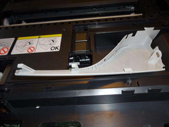 How to Unclog Brother Inkjet Print head Nozzles, Remove the front corners by gently pulling upwards: crwdns2935265:08crwdnd2935265:02crwdnd2935265:02crwdne2935265:0