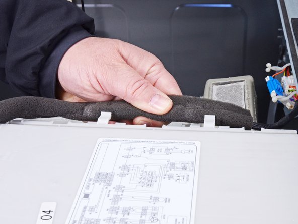 LG Front Load Washing Machine Detergent Dispenser Replacement, Unclip the control panel cable: crwdns2935265:08crwdnd2935265:02crwdnd2935265:03crwdne2935265:0