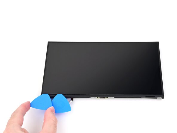 Nintendo Switch 2 Screen Replacement, Separate the left adhesive: crwdns2935265:050crwdnd2935265:02crwdnd2935265:03crwdne2935265:0