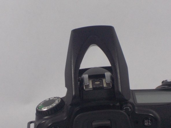 Nikon D90 Flash Bulb Replacement, Removing the Top Flash Casing: crwdns2935265:03crwdnd2935265:02crwdnd2935265:03crwdne2935265:0