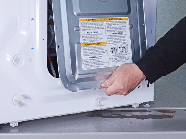 LG Front Load Washing Machine Pump Hose Replacement, Remove the rear panel: crwdns2935265:029crwdnd2935265:03crwdnd2935265:03crwdne2935265:0