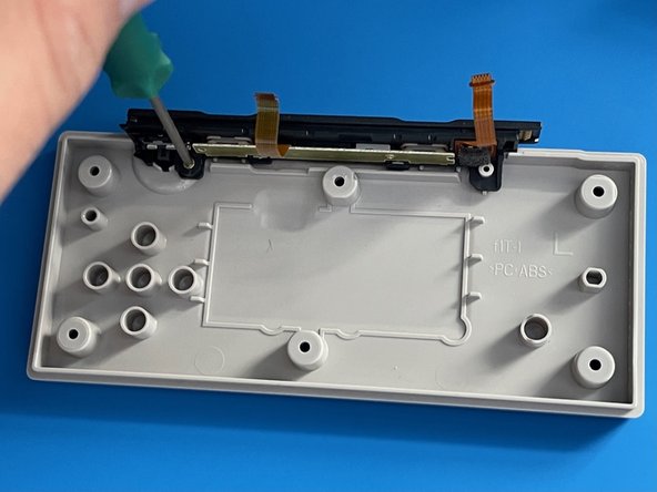 Left Nintendo Switch NES Controller Charging Rail Replacement, Remove the charging rail: crwdns2935265:04crwdnd2935265:02crwdnd2935265:03crwdne2935265:0