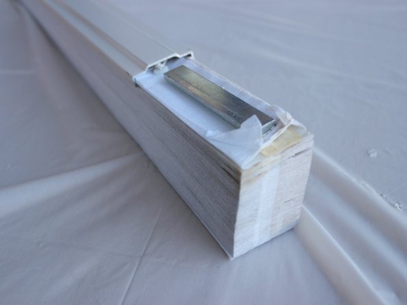 Push the bottom end caps back onto the rail.