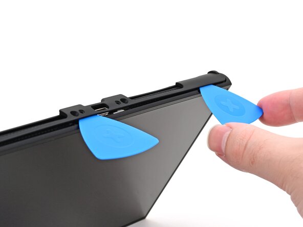 Nintendo Switch 2 Microphone Replacement, Insert a second opening pick: crwdns2935265:015crwdnd2935265:03crwdnd2935265:03crwdne2935265:0