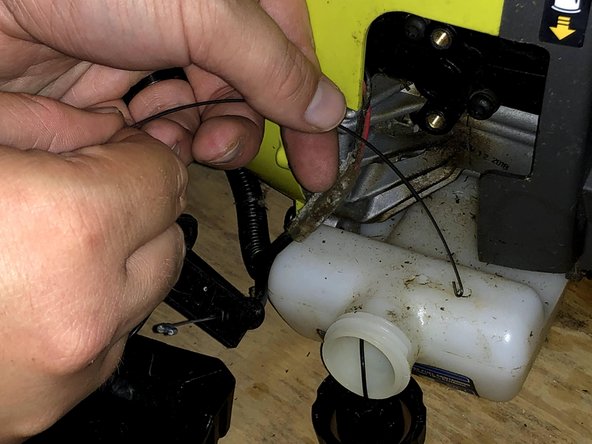 Thread the gripping tool through the input line on the tank.