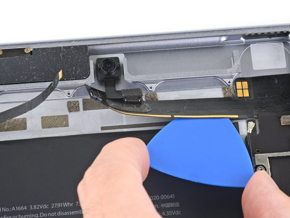 iPad Pro 9.7" Battery Replacement, Cut through the adhesive under the upper arm: step 88, image 2 of 2