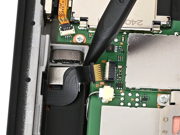 Nintendo Switch 2 Right Joy-Con 2 Connector Replacement, Lift the cable: crwdns2935265:038crwdnd2935265:01crwdnd2935265:03crwdne2935265:0