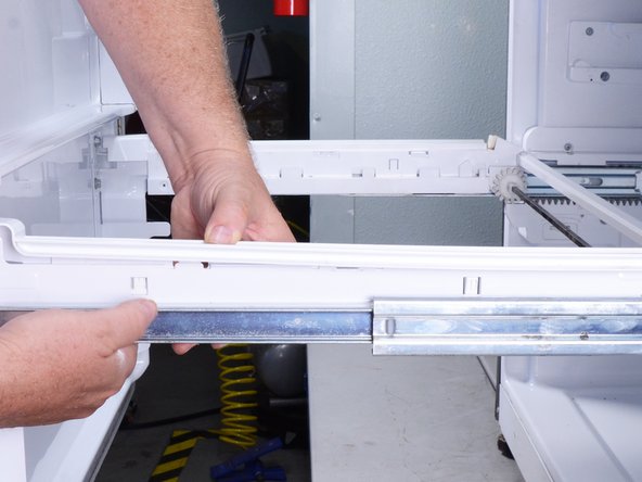 LG Refrigerator Evaporator Fan Replacement, Remove the drawer rail covers: crwdns2935265:04crwdnd2935265:02crwdnd2935265:03crwdne2935265:0